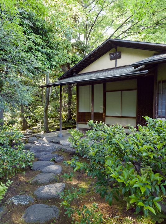 Stone path leading to a small tea house