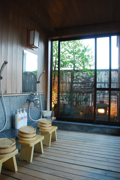 Japanese washing area with stools and hand showers