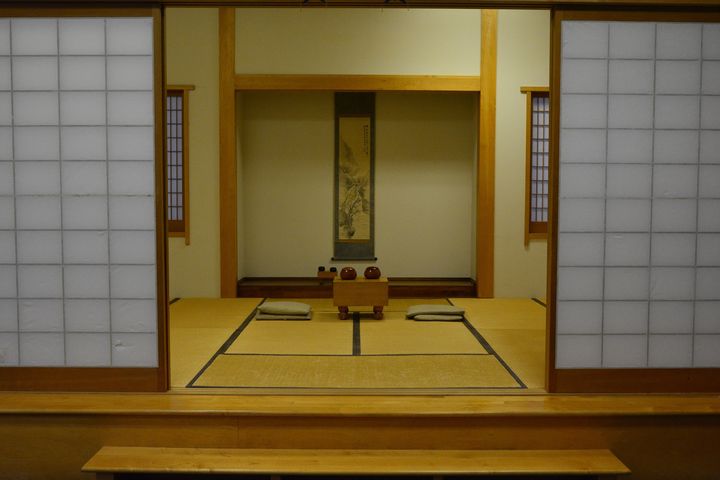 Tatami room with shoji screens and a tokonoma alcove