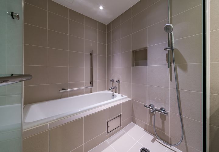 Japanese wet room with deep tub and shower